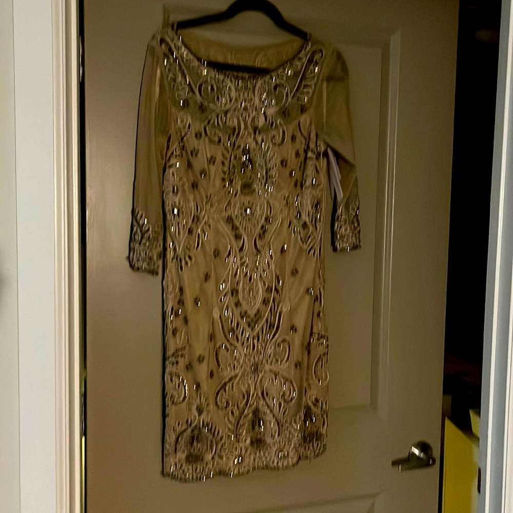 NWT knee length long sleeved gown. This is gorgeous and elegant.